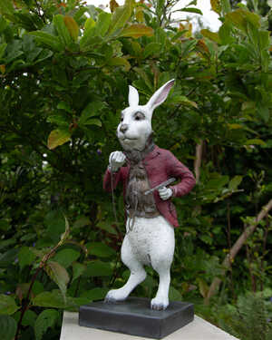 white rabbit sculpture on a plinth white rabbit sculpture on a plinth