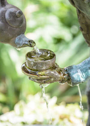 Bronze detail of Mad Hatter water feature