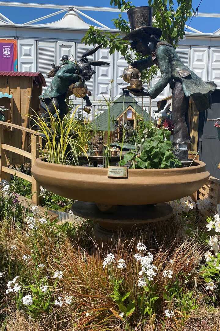 Tea Party Urn bronze water feature on display at RHS Chelsea Flower Show 2024