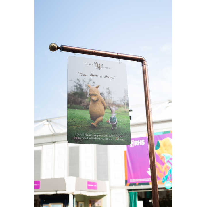 Robert James Workshop sign, featuring Winnie the Pooh and Piglet