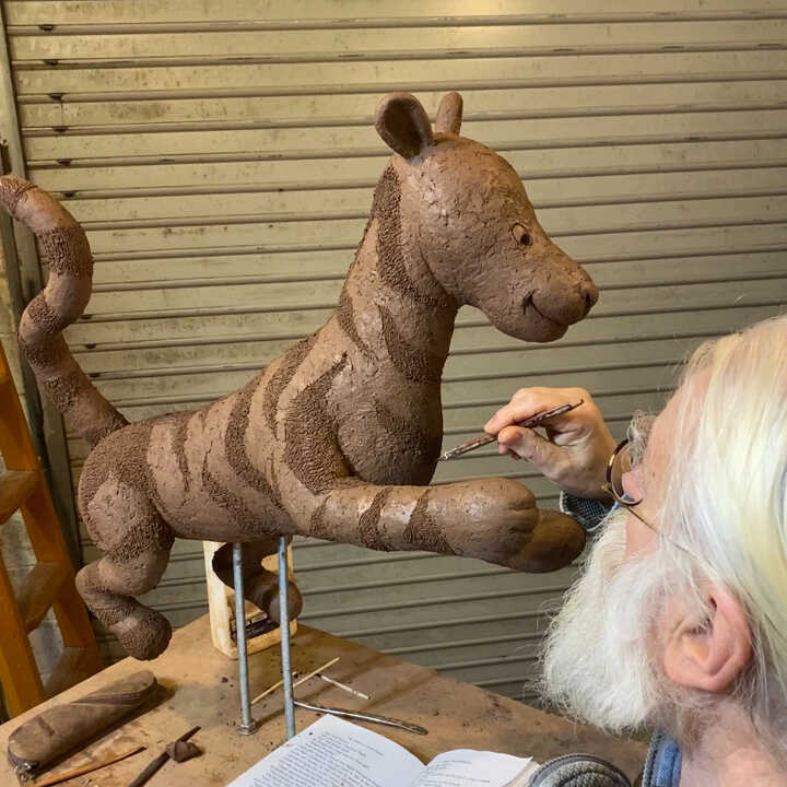 Robert adds detail to the clay mould of Tigger
