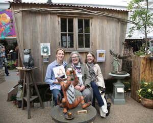 Louis, Tacy and Cally at Chelsea 2025 sitting in front of the Tiger Who Came to Tea sculpture