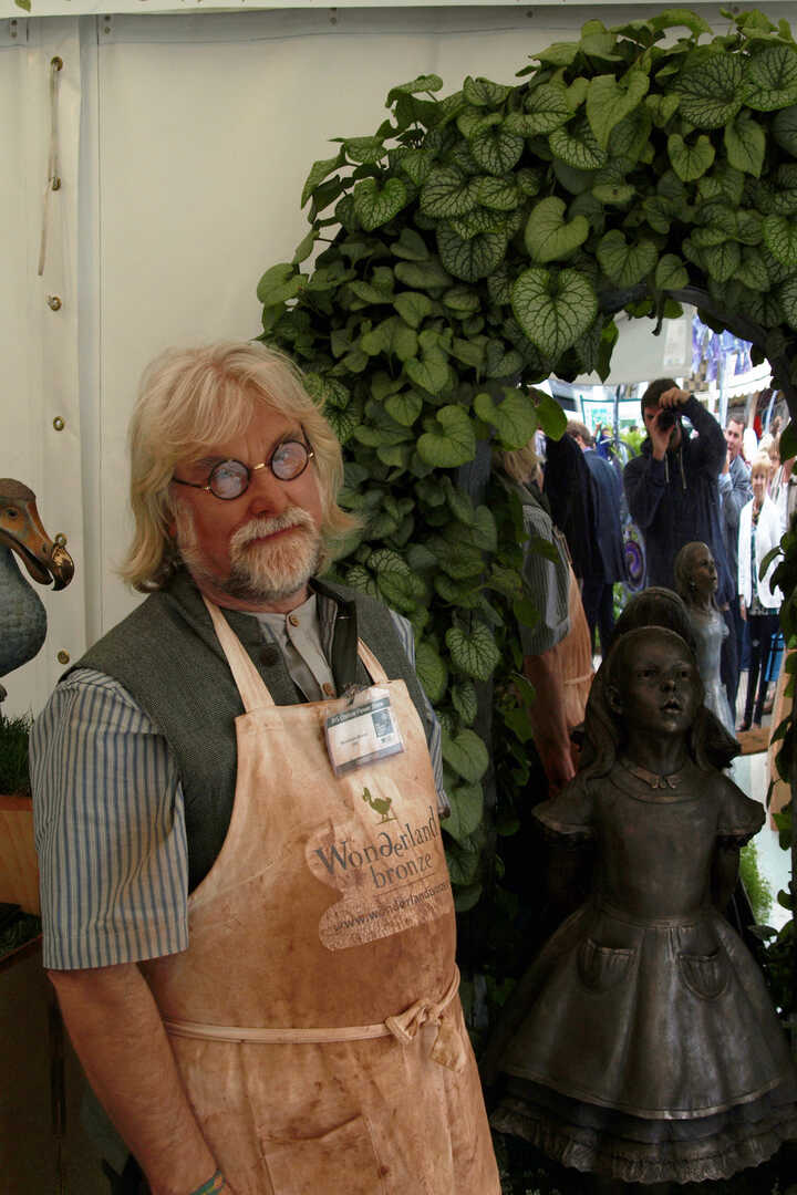 Robert from Robert James Workshop standing next to Alice sculpture at RHS Chelsea Flower Show 2011