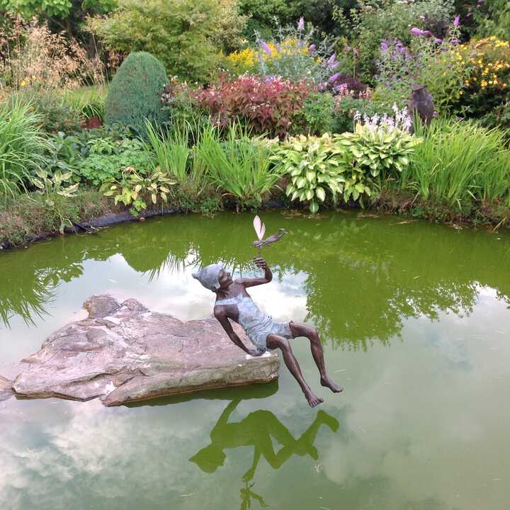 Peter Pan and Tinker Bell sculpture on the water