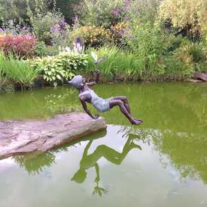 Peter Pan and Tinker Bell sculpture installed on the pond