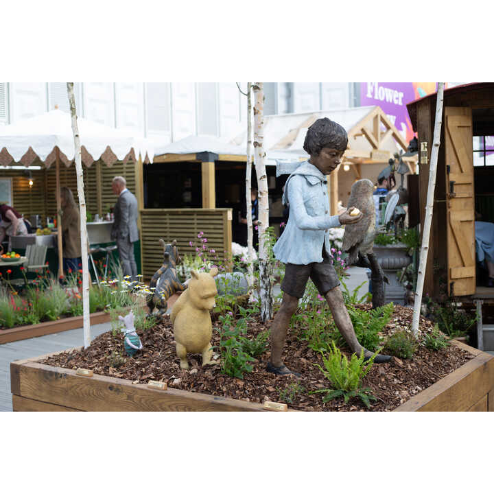 A.A. Milne bronze sculptures by Robert James Workshop, displayed at RHS Chelsea Flower Show 2026, including Christopher Robin, Winnie the Pooh, Piglet, Wol, and Tigger