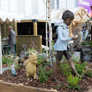 A.A. Milne bronze sculptures by Robert James Workshop, displayed at RHS Chelsea Flower Show 2026, including Christopher Robin, Winnie the Pooh, Piglet, Wol, and Tigger