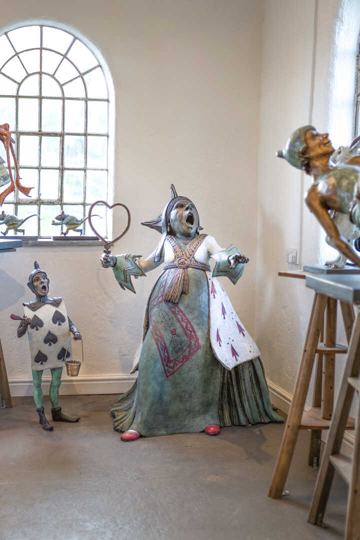 queen of hearts sculpture and peter pan water feature displayed at robert james workshop gallery
