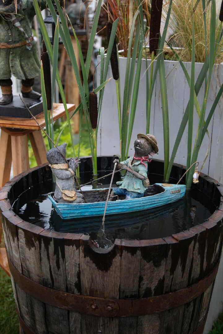 Ratty and Mole rowing boat water feature on the river