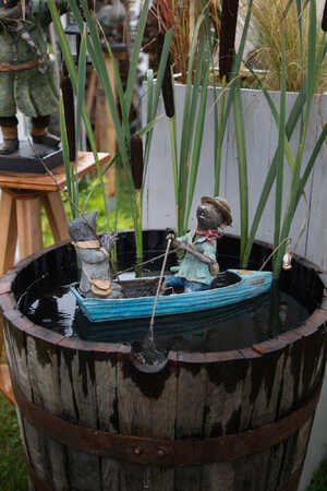 Ratty and Mole rowing boat water feature on the river