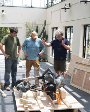 Jim and the Robert James Workshop team unbox Mad Hatter Tea Party sculpture at Abernethy and Spencer