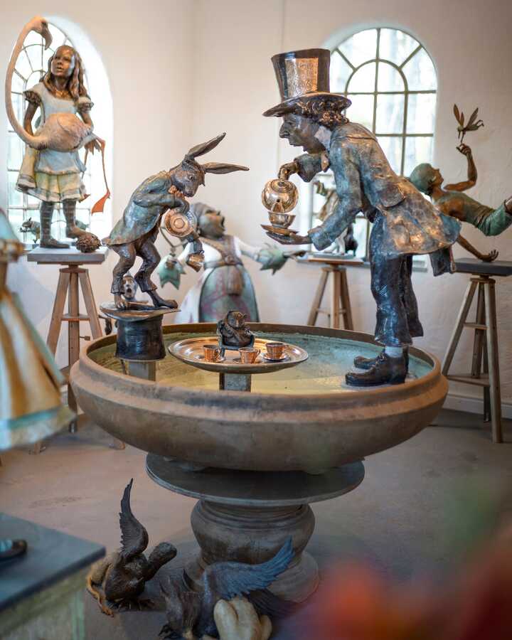 Bronze garden sculptures and water features in the Robert James Workshop Gallery including Mad Hatter Tea Party Urn, Peter Pan, Queen of Hearts, Alice and Flamingo and more