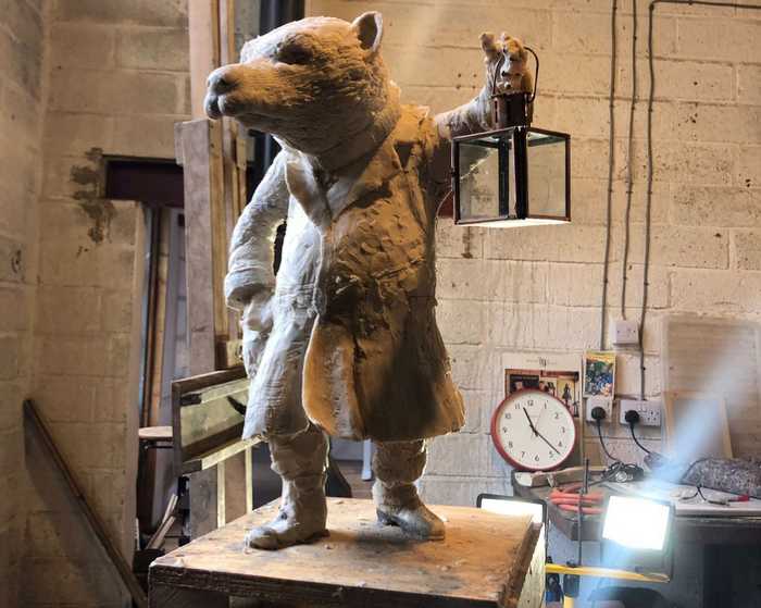 badger sculpture with lantern