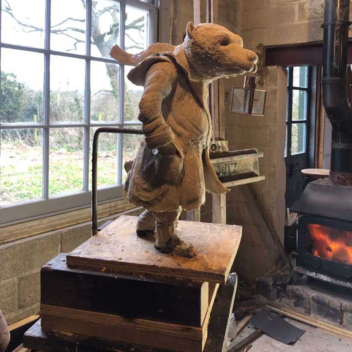 badger with lantern in workshop