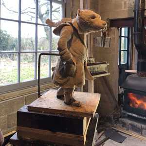 badger with lantern in workshop