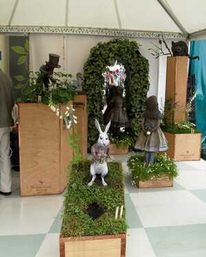 White Rabbit, Alice and other Lewis Carroll-inspired bronze garden sculptures displayed at RHS Chelsea Flower Show 2011