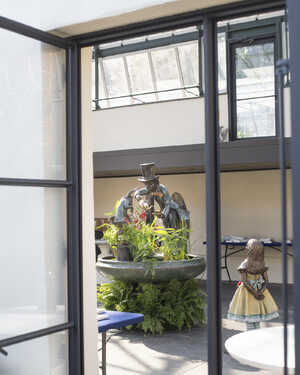 Mad Hatter Tea Part Water Feautre and Alice installed at Abernethy & Spencer glasshouse in Virginia USA
