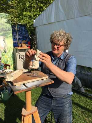 Jim working on Wind in the Willows sculpture at Badminton