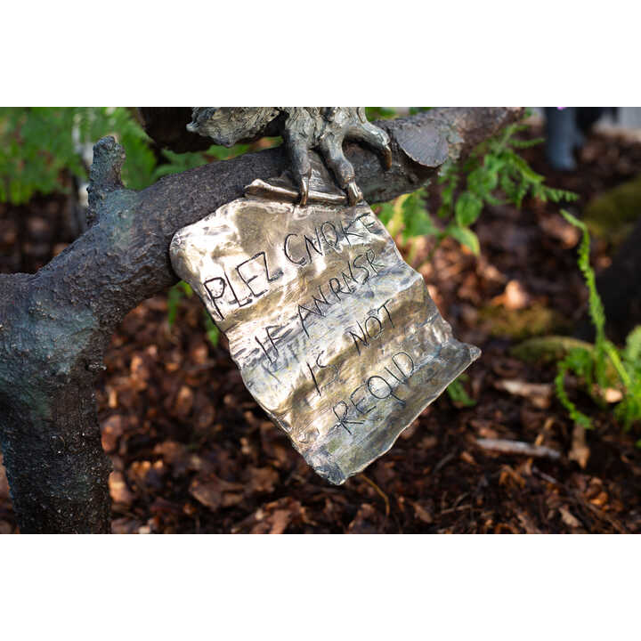 Note attatched to Wol's claws, from Robert James Workshop garden sculpture